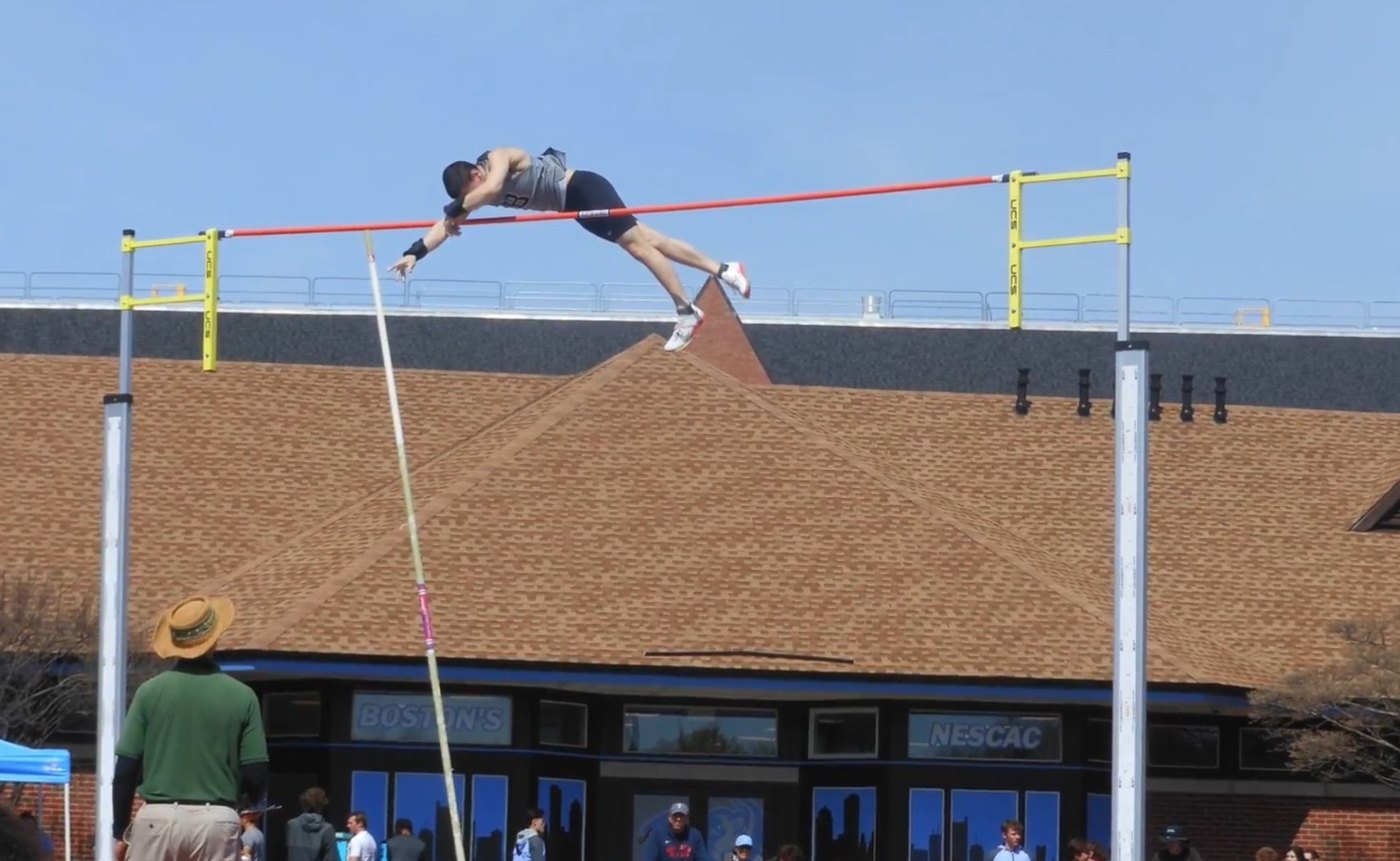 Ethan clearing the bar at a NESCAC pole vault meet for Bowdoin